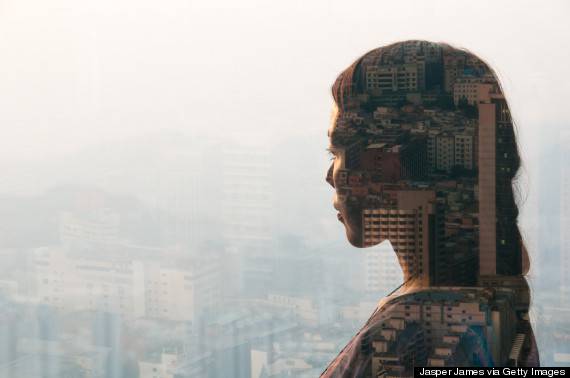 double exposure of woman and cityscape